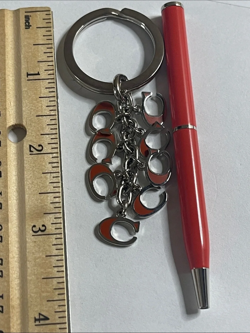 Coach Silver-Tone Keyring with Orange Enamel 'C' Charms